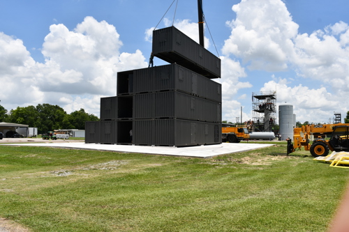 Shipping containers being stacked